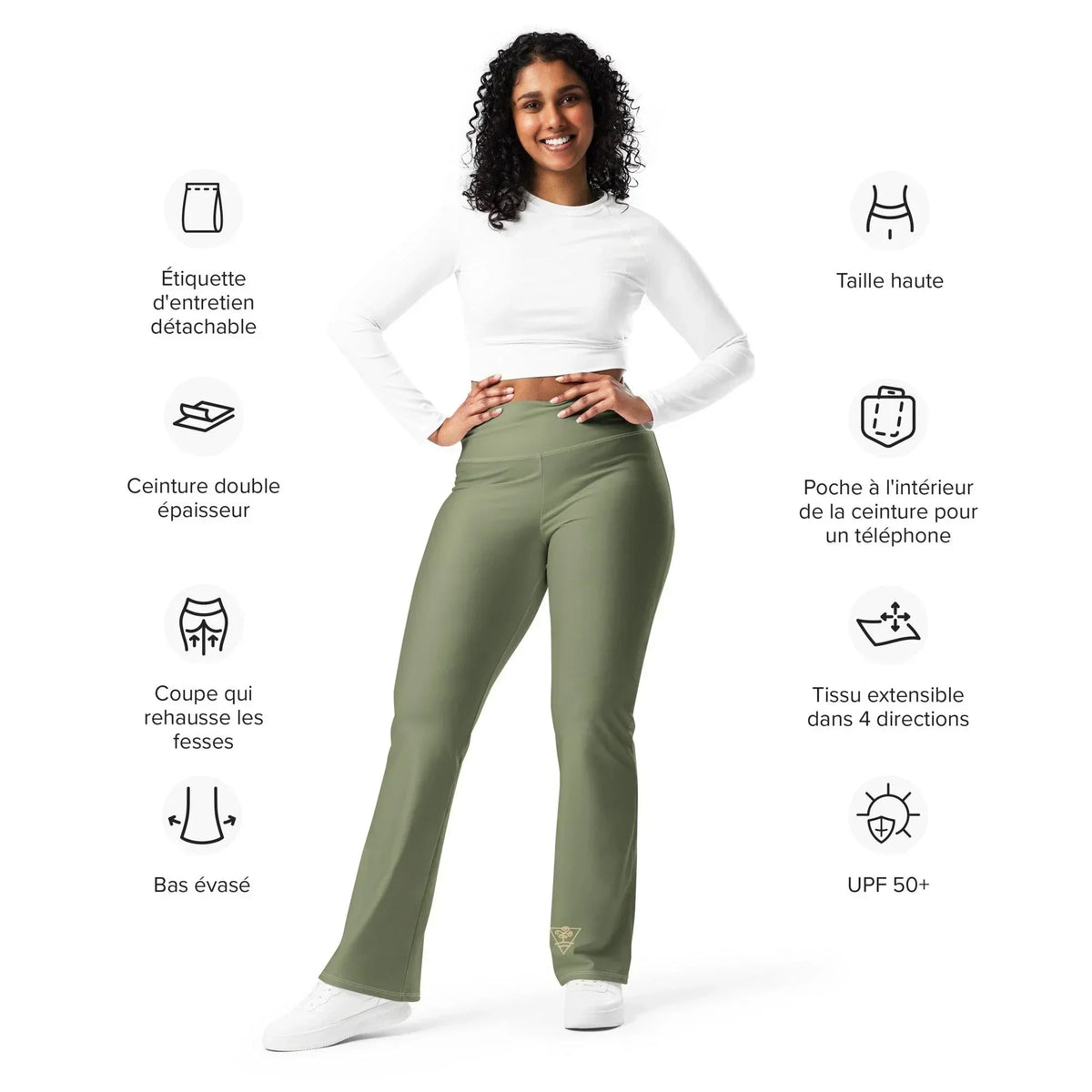 Frau in olivgrünen CREWILD MAOB Leggings mit Schlag und weißem Longshirt.