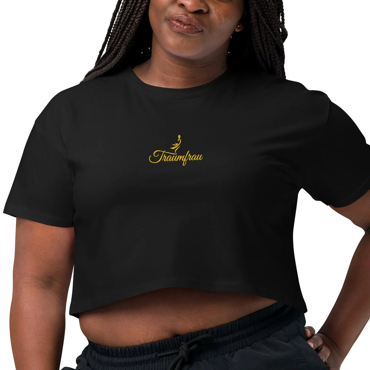 Schwarzes CREWILD Crop-Top T-Shirt für Damen mit goldenem „Traumfrau“-Schriftzug und Logo.