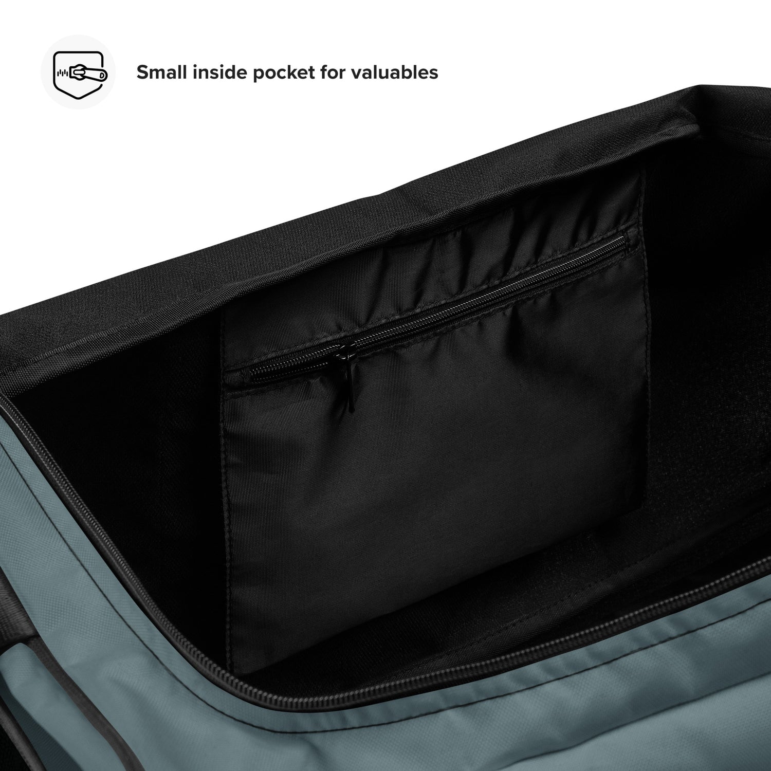 Detailansicht einer kleinen Innentasche mit Reißverschluss in einer grauen Tasche
