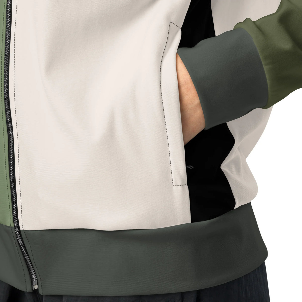 Detailansicht der CREWILD Jacke in Creme und Grün mit Seitentasche und Reißverschluss