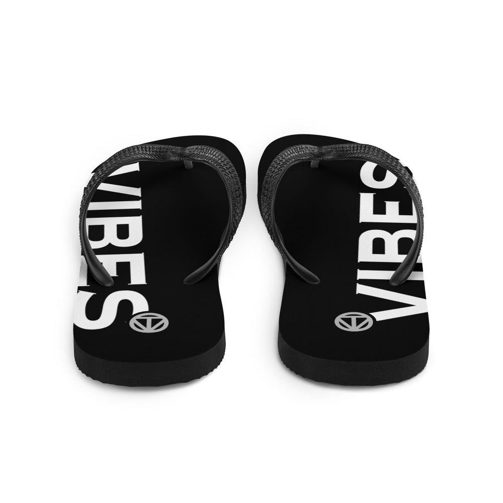 Schwarze Flip Flops mit weißem Vibes-Schriftzug, klassische Zehensandalen, Oberansicht